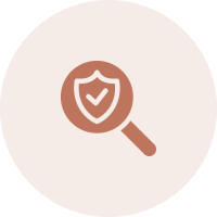 Magnifying glass with shield and checkmark symbol.